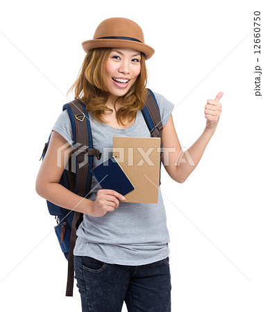 Woman hold with passport and thumb up 12660750
