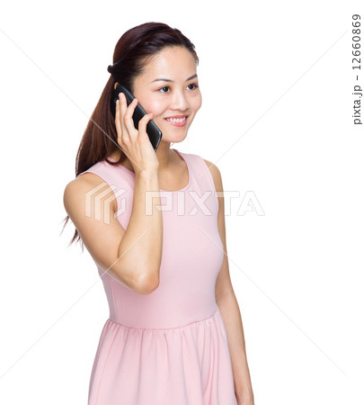 Asian woman talk to mobile phone 12660869