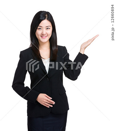 Asian business woman with open hand palm 12660894