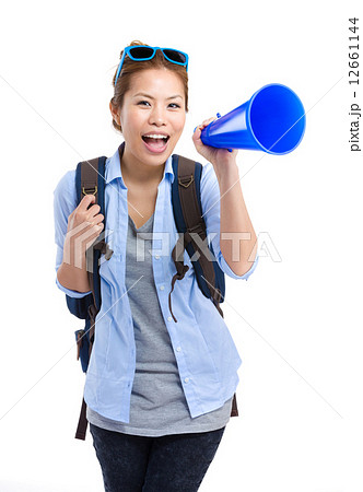 Asian female traveler yell with megaphone Asian female traveler yell with megaphone 12661144