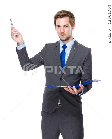 Caucasian businessman with clipboard and pen up 12661368