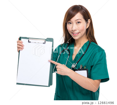 Female doctor finger point to clipboard with white paper Female doctor finger point to clipboard with white paper 12661496