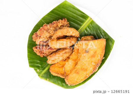 Fried banana and sweet potatoes served on banana leaf 12665191