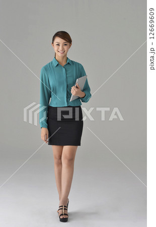 an confident asian office lady with a tablet an confident asian office lady with a tablet 12669609