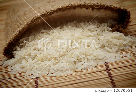 White uncooked rice in small sack 12670051