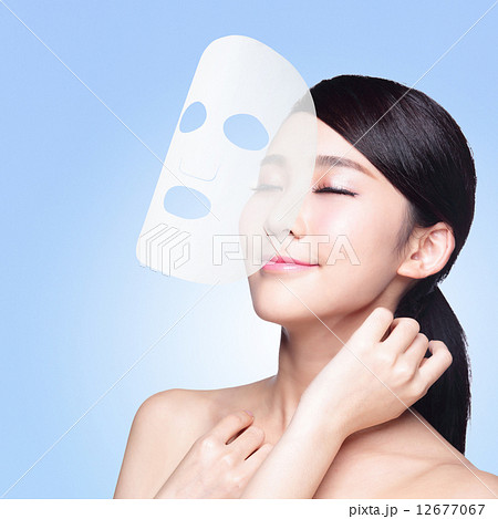 woman with cloth facial mask 12677067
