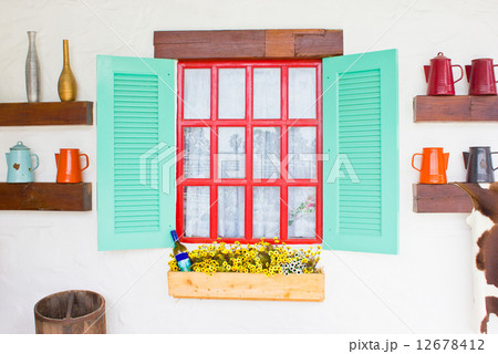 Colorful window with decorating stuffs. 12678412