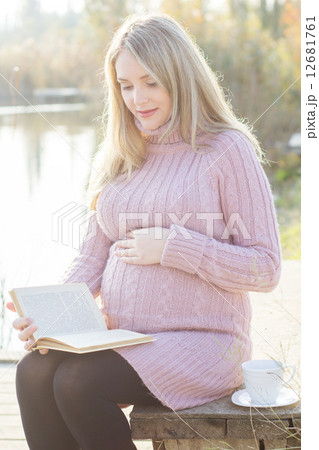 Pregnant woman on the autumn lake Pregnant woman on the autumn lake 12681761