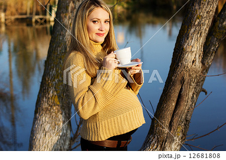 Pregnant woman on the autumn lake 12681808
