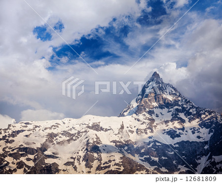 Snowcapped summit top of mountain in Himalayas 12681809