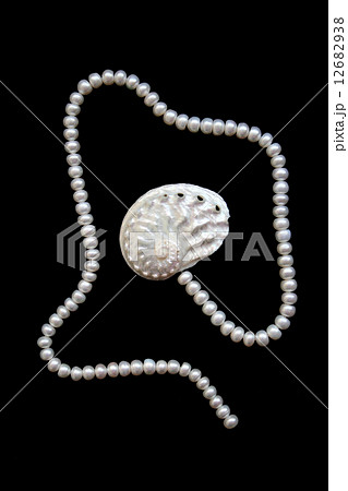 White pearls and nacreous cockleshell 12682938