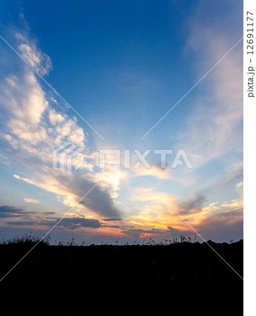 African sunset with dramatic clouds on sky 12691177