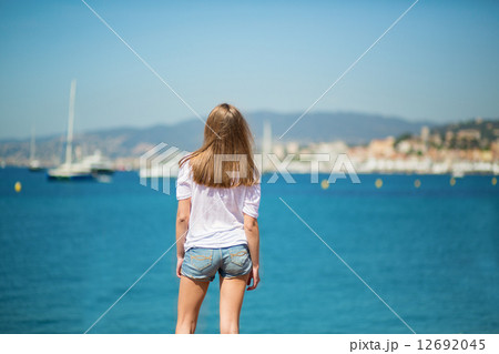 Beautiful young girl on the beach in Cannes 12692045