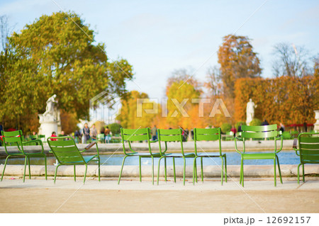 Traditional green chairs in Tuileries garden 12692157