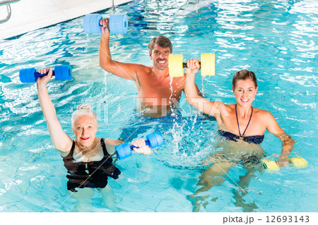Group of people at water gymnastics or aquarobics 12693143