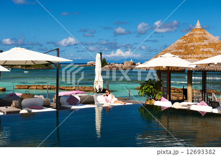 Woman at poolside 12693382