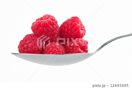 ripe red raspberry in spoon 12693895