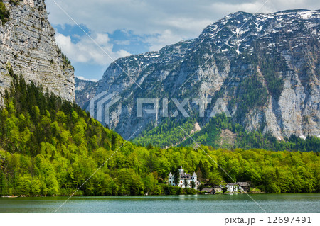 Castle at Hallst**tter See mountain lake in Austria 12697491