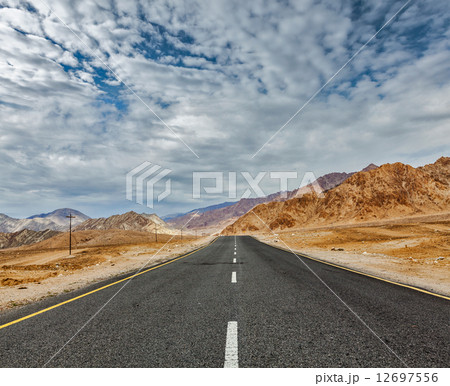 Road in Himalayas with mountains Road in Himalayas with mountains 12697556