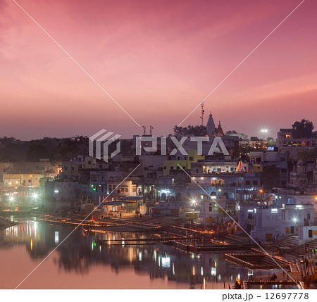 Sacred Puskhar lake (Sagar) and ghats of town Pushkar in twilig Sacred Puskhar lake (Sagar) and ghats of town Pushkar in twilig 12697778