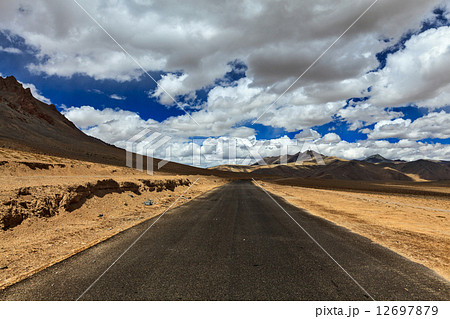 Road on plains in Himalayas with mountains Road on plains in Himalayas with mountains 12697879