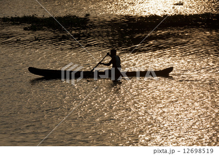 Man in canoe. Kerala backwaters, India Man in canoe. Kerala backwaters, India 12698519