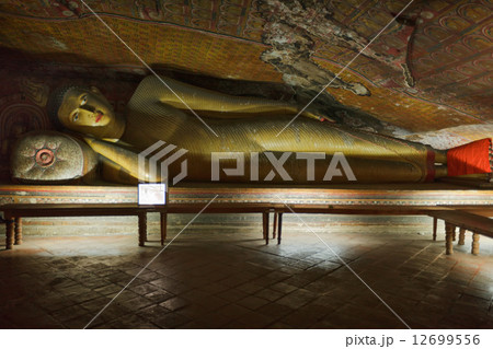 Ancient Buddha image in Dambulla Rock Temple caves, Sri Lanka 12699556