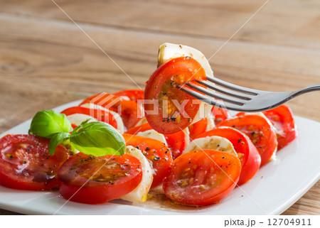 Caprese salad tomato mozzarella with basil Caprese salad tomato mozzarella with basil 12704911