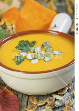 Pumpkin soup with seeds and parsley. 12707607