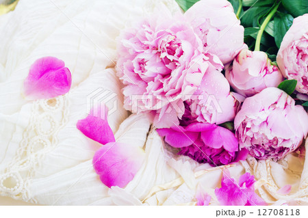 pink peonies and white wedding dress 12708118