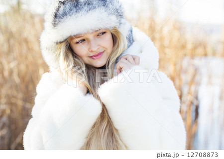 Cute little girl in winter clothes outdoors Cute little girl in winter clothes outdoors 12708873