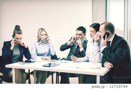 business team with smartphones having conversation 12710794
