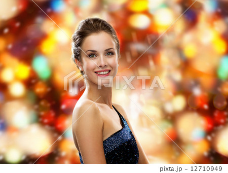 smiling woman in evening dress 12710949