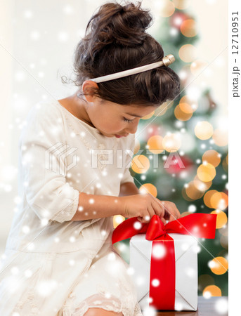 smiling little girl with gift box smiling little girl with gift box 12710951