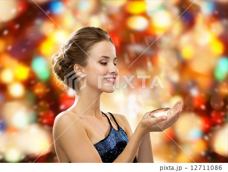 smiling woman in evening dress with diamond smiling woman in evening dress with diamond 12711086