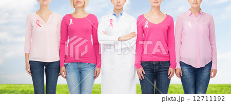 close up of women with cancer awareness ribbons 12711192