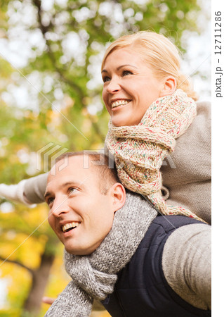 smiling couple having fun in autumn park smiling couple having fun in autumn park 12711286