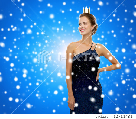 smiling woman in evening dress wearing crown smiling woman in evening dress wearing crown 12711431