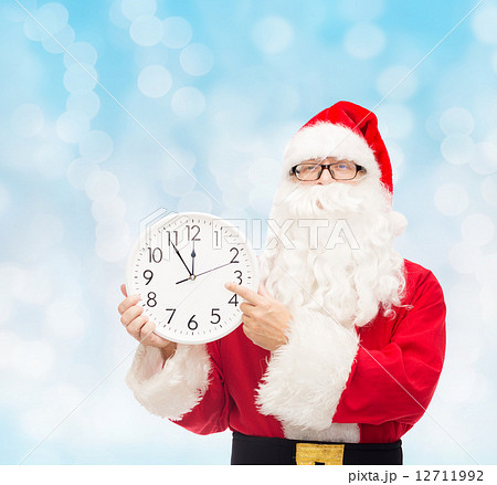 man in costume of santa claus with clock 12711992