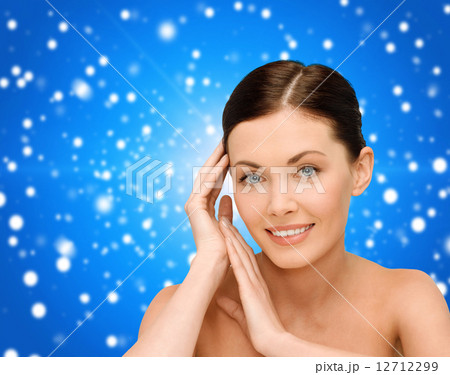smiling young woman with bare shoulders smiling young woman with bare shoulders 12712299
