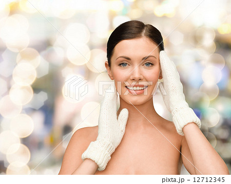smiling young woman in white mittens smiling young woman in white mittens 12712345