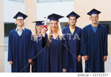 group of smiling students in mortarboards 12712357