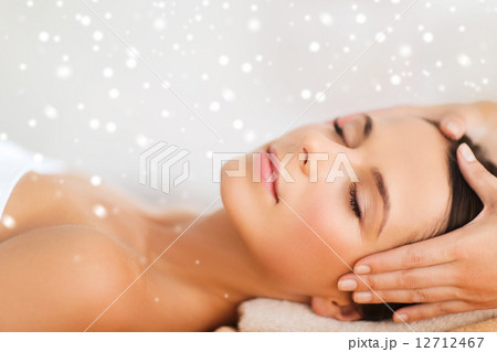 beautiful woman getting face or head massage 12712467