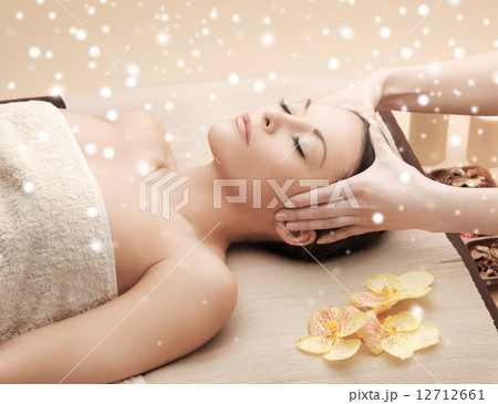 beautiful woman getting face or head massage beautiful woman getting face or head massage 12712661