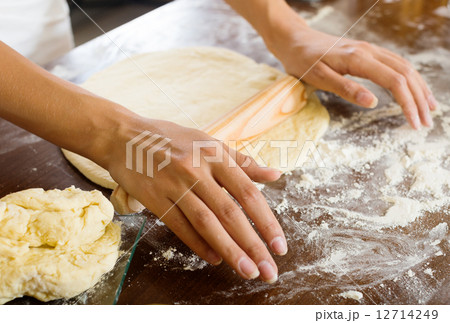Closeup of housewife cooking dough Closeup of housewife cooking dough 12714249