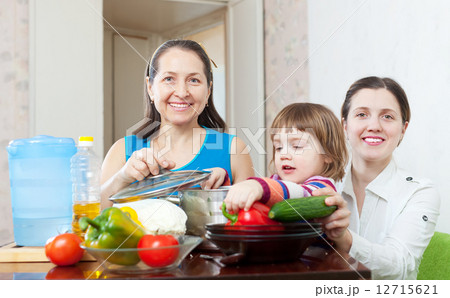 Happy family cooking lunch 12715621