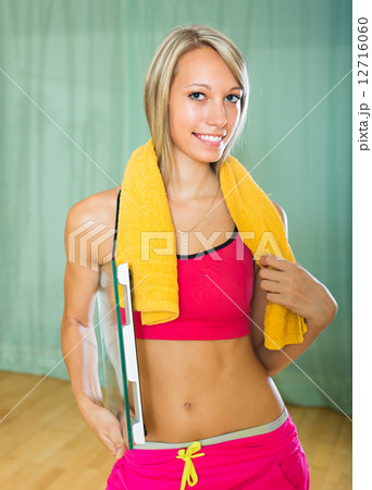 Girl with scales and towel indoor Girl with scales and towel indoor 12716060