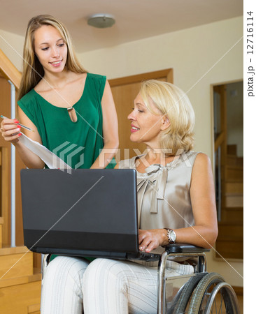 Happy woman in wheelchair 12716114