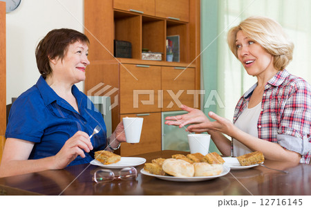 Elderly women at the table with tea 12716145