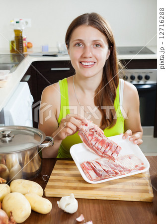 Young woman with lamb meat Young woman with lamb meat 12716288
